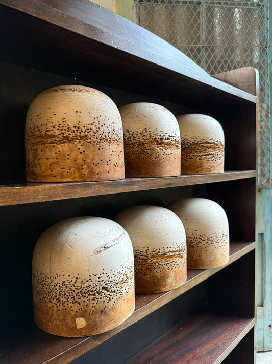 A Set of Six Wooden Millinery Hat Forms