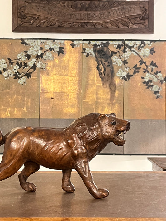 A 1960s leather Lion Desk Toy.