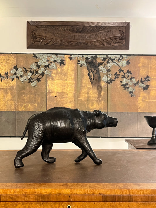 A 1960s leather Brown Bear Desk Toy.