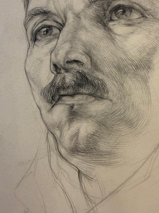 A Life Pencil Drawing of a Gentleman on paper.