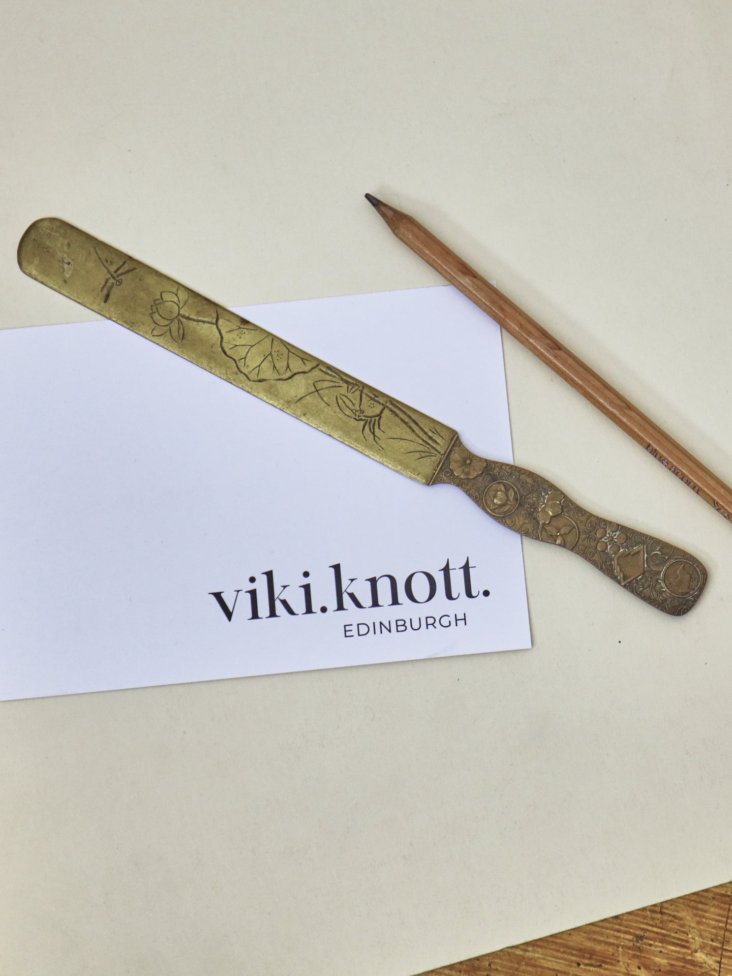 A Japanese brass page turner, Meiji Period (1868-1912) ~ Flowers & Insects