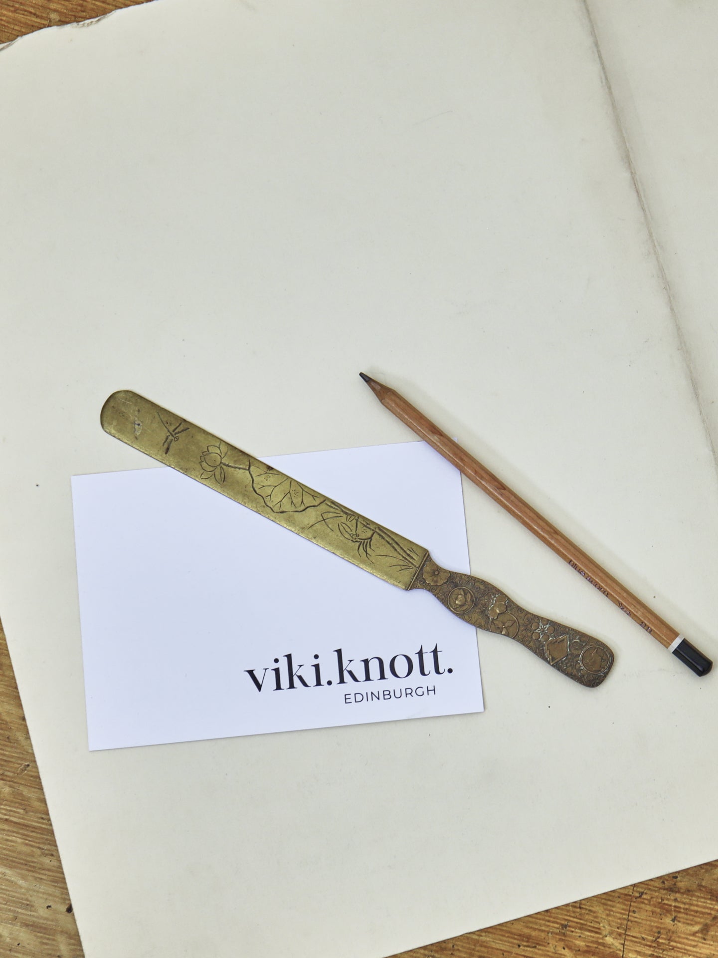 A Japanese brass page turner, Meiji Period (1868-1912) ~ Flowers & Insects