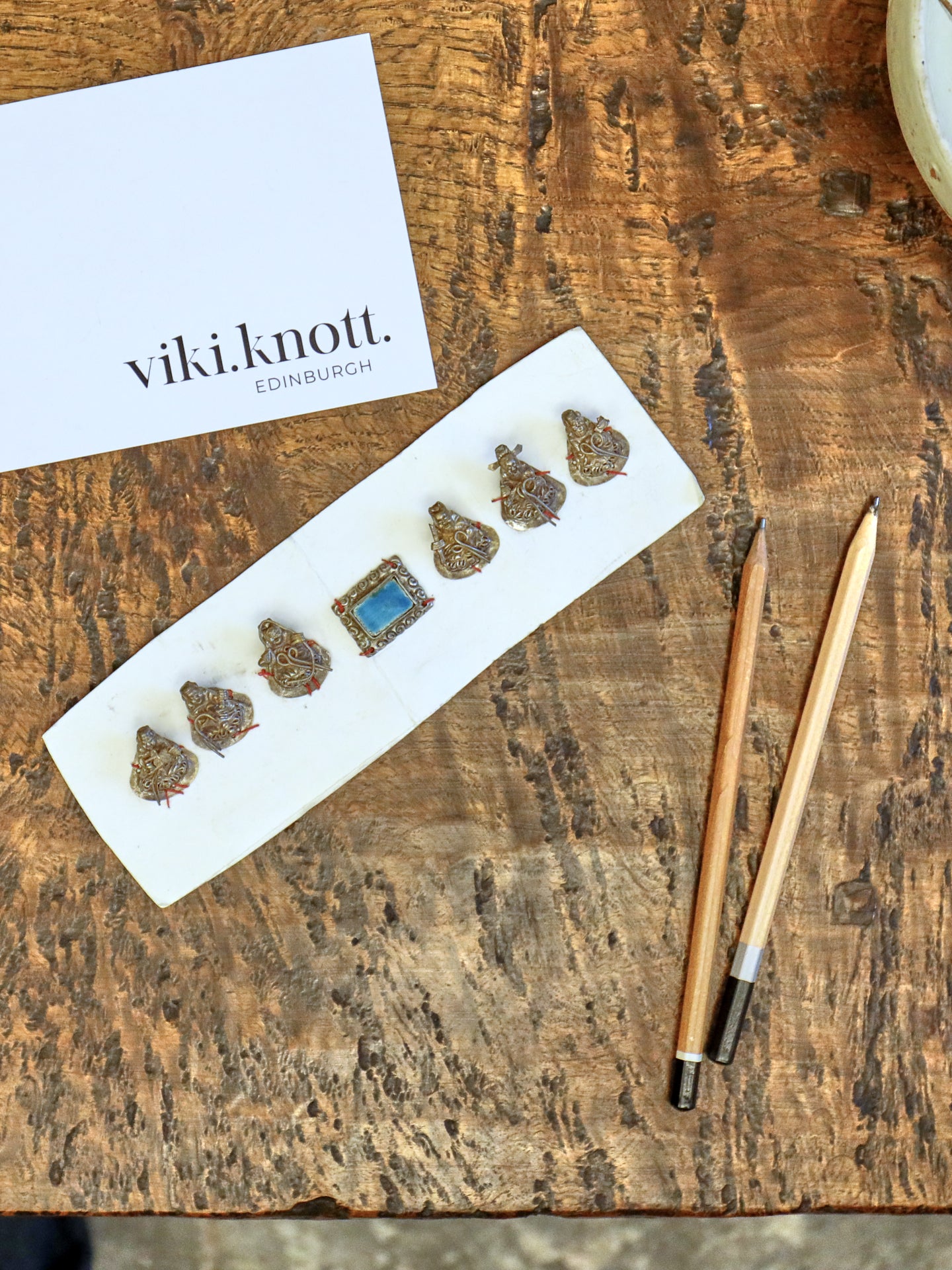 A Set of Seven Chinese Figurine Hat Ornaments