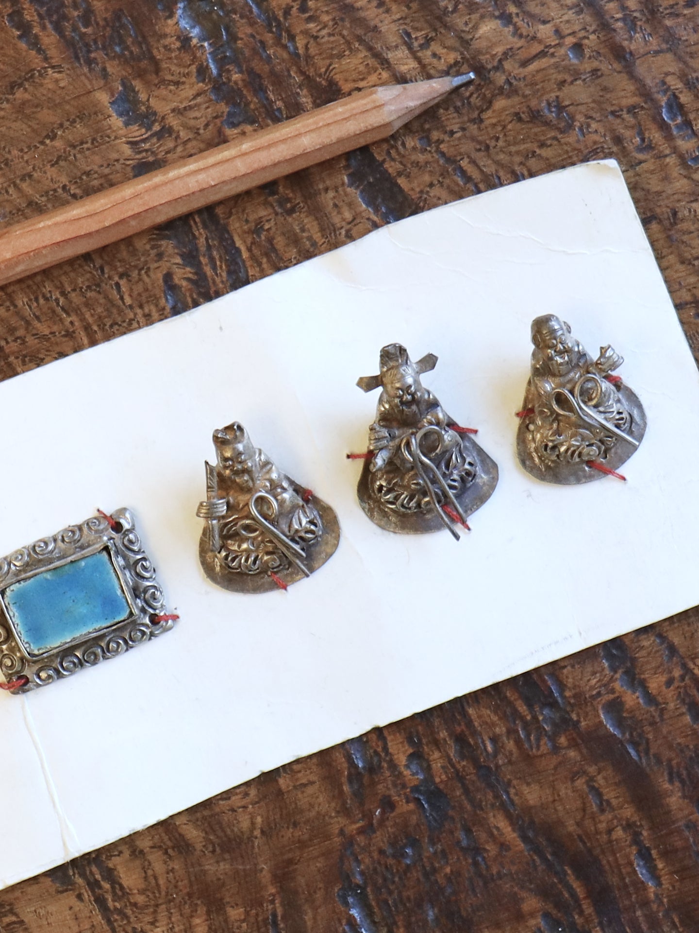 A Set of Seven Chinese Figurine Hat Ornaments