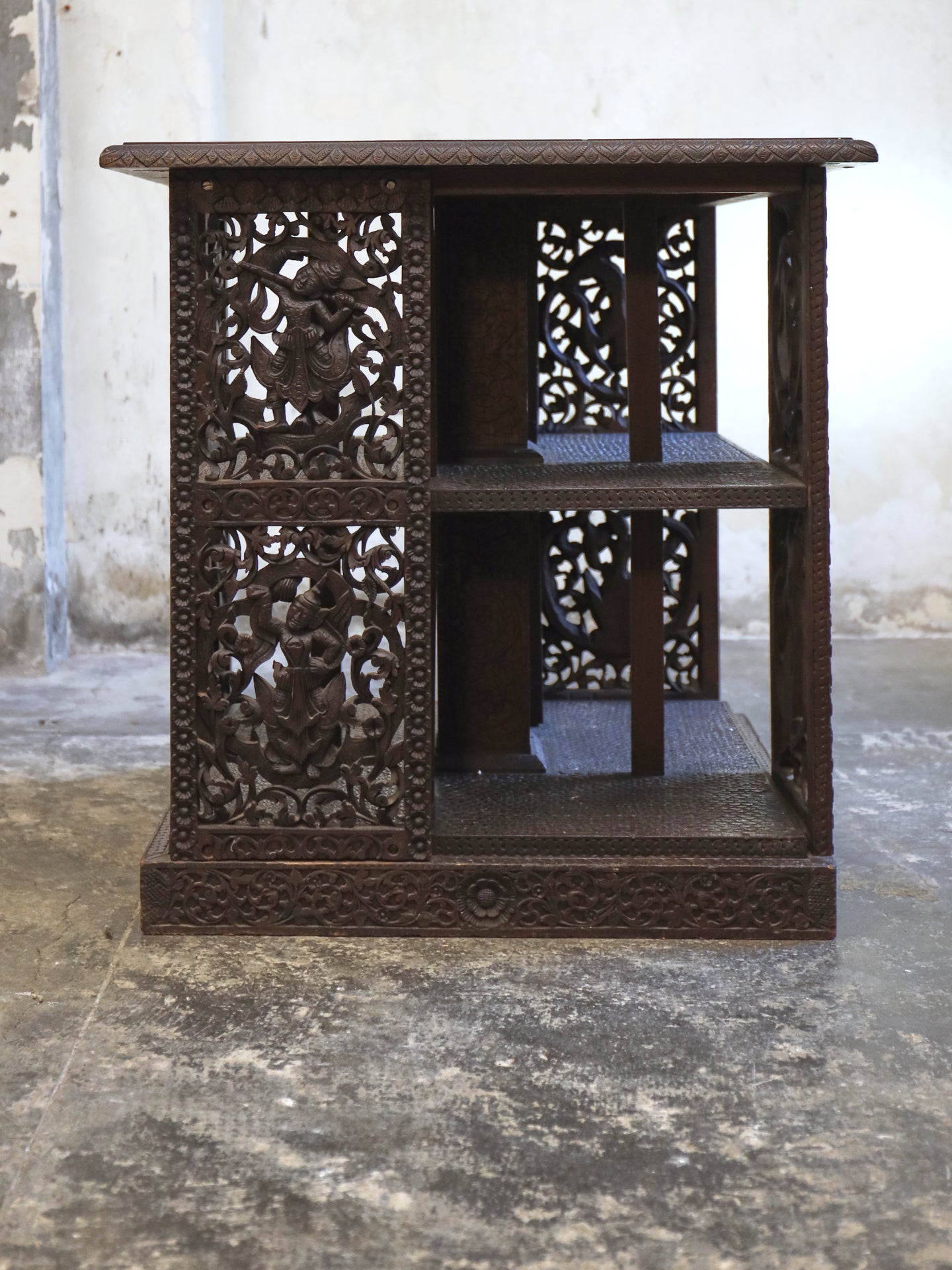 A profusely carved four sided Bookcase - 1920's